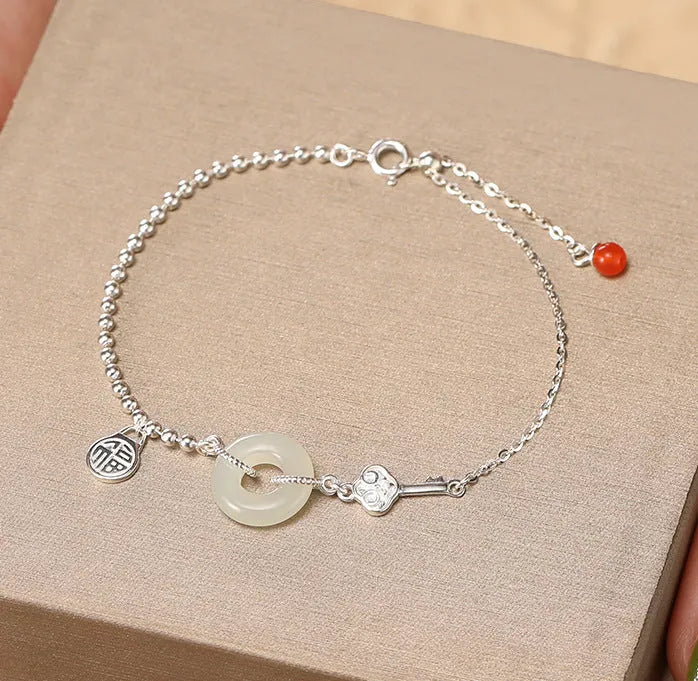 Silver Hetian jade bracelet with blessing card and peace buckle design in geometric Chinese style