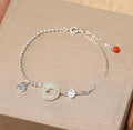 Silver Hetian jade bracelet with blessing card and peace buckle design in geometric Chinese style