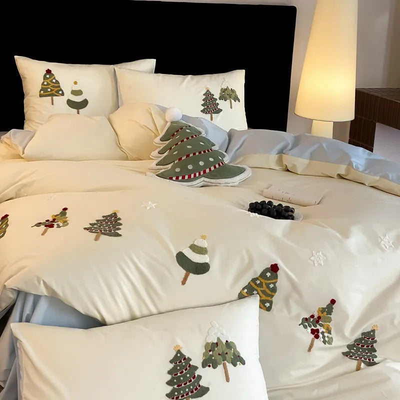 Cream Blue cotton bedding set with embroidered Christmas tree and floral pattern, showing duvet cover and pillowcases.