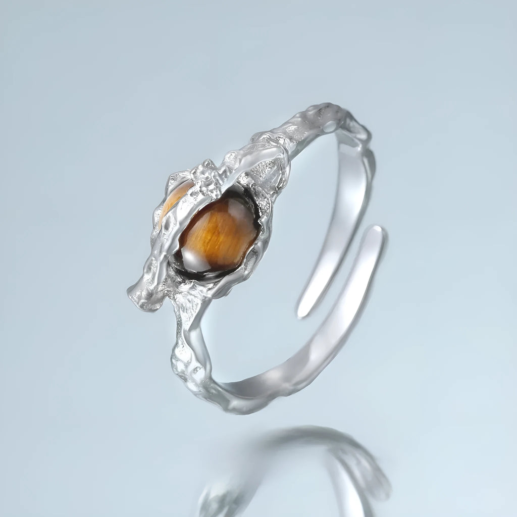 Saturn-inspired adjustable open ring with white gold electroplated finish and silver base