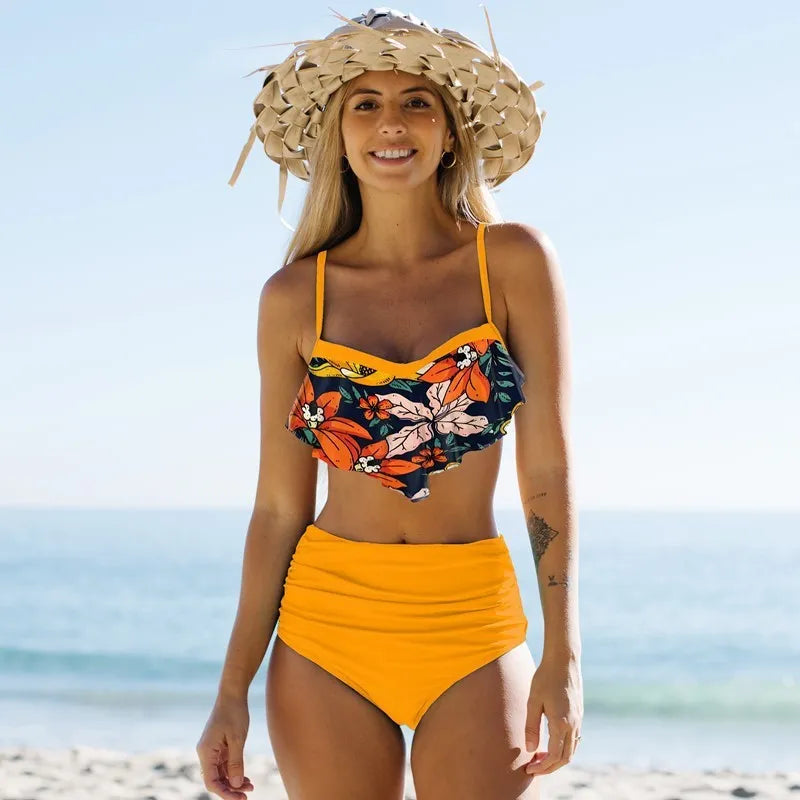 Green high-waisted floral bikini swimsuit with pleated pants for women.