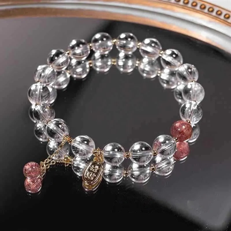 Natural white crystal lucky fortune bracelet on display with beads arranged in a U-shape on a neutral background.