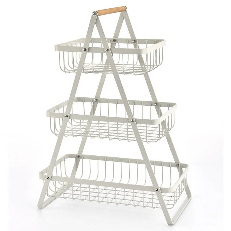 Detachable iron double-layer fruit basket with wooden handle on a kitchen table, black finish