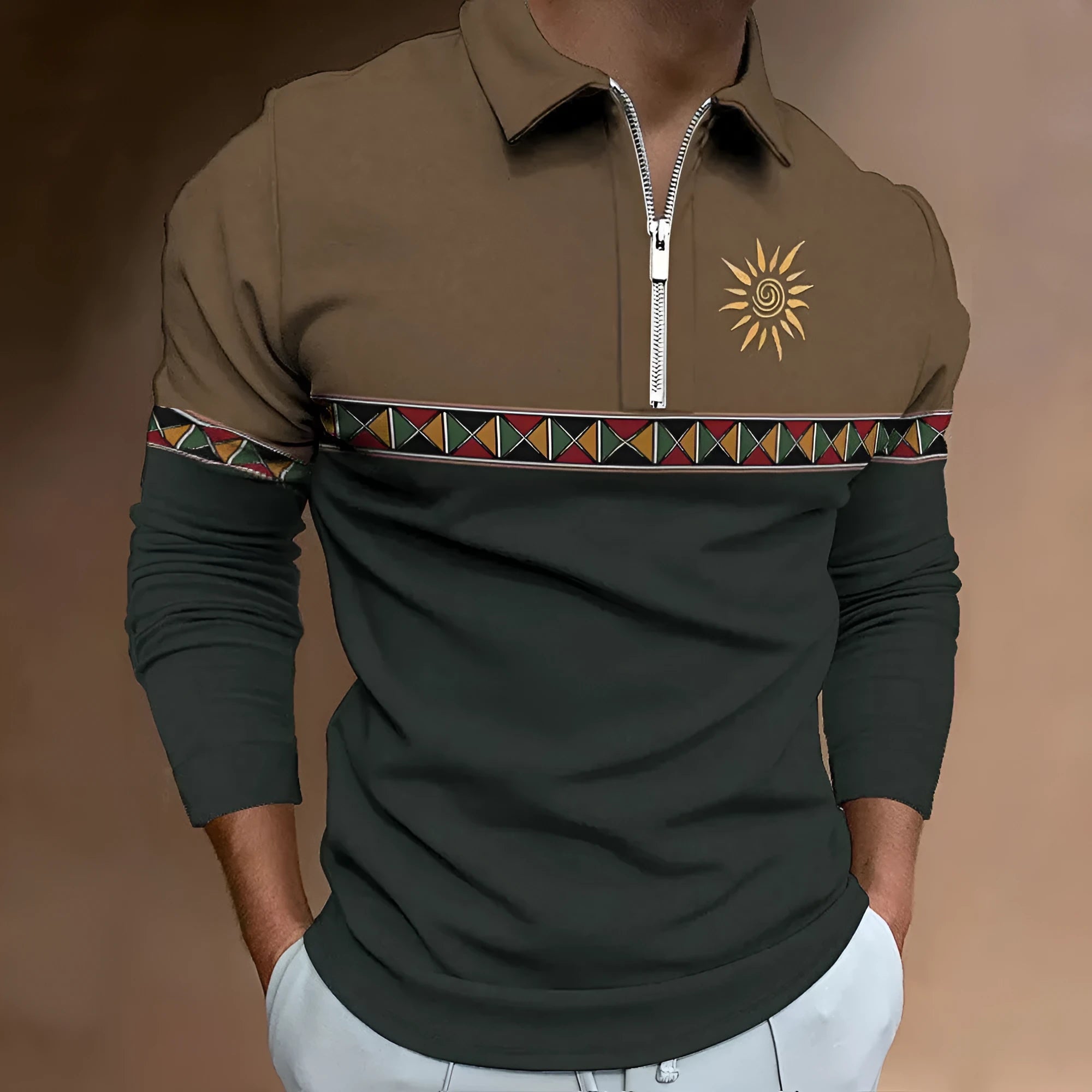 Man wearing a loose-fit long sleeve t-shirt with retro colour block printing and a decorative zipper detail.
