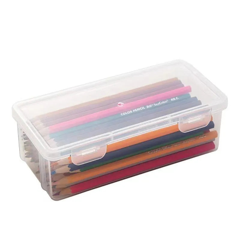 Large transparent plastic stationery storage box filled with colour pencils and crayons.