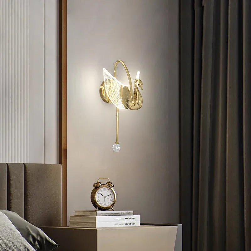 Gold swan-shaped wall lamp with iron construction and acrylic shade