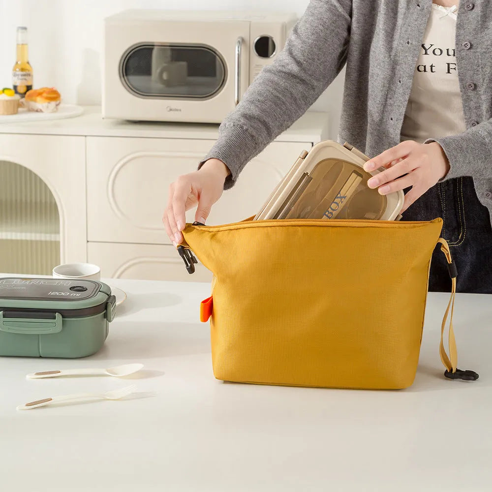 Japanese style insulated lunch bag in Oxford cloth, shown in one of four colours.
