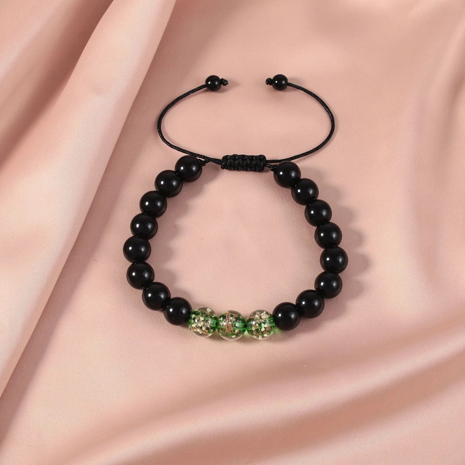 Beaded adjustable luminous bracelet in six colours: black, red, green, pink, blue, sapphire blue, glass or coloured glaze beads, geometric shape