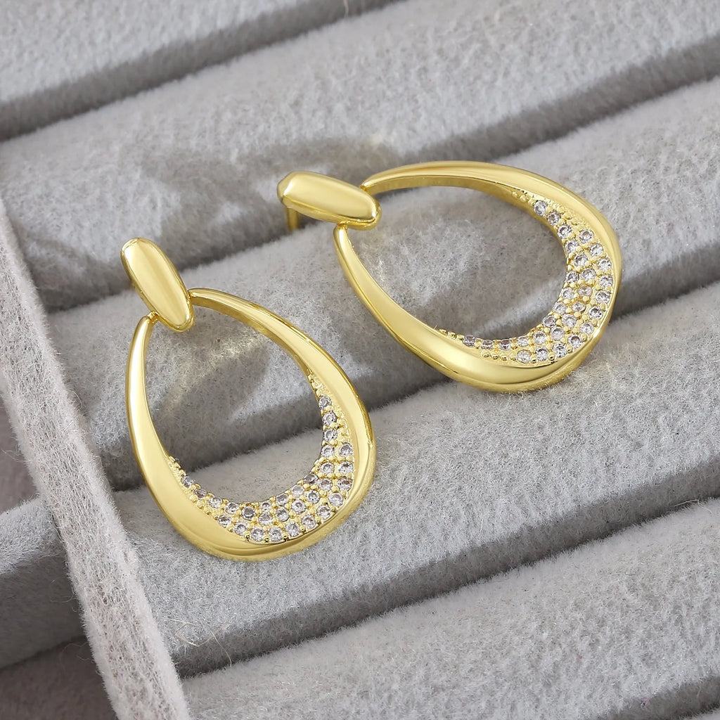 Women's yellow gold geometric drop earrings with zircon detailing measuring 2.6cm by 1.7cm