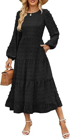 A woman wearing a beige high waist long sleeve dress with ruffle details on a autumn day.