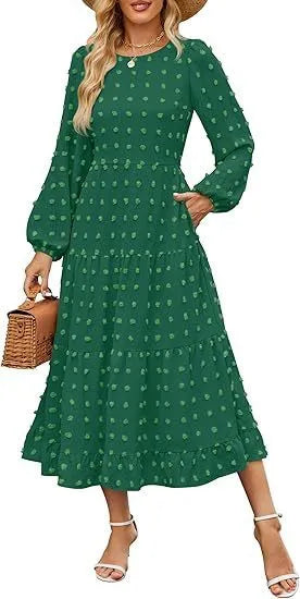 A woman wearing a beige high waist long sleeve dress with ruffle details on a autumn day.