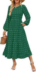 A woman wearing a beige high waist long sleeve dress with ruffle details on a autumn day.