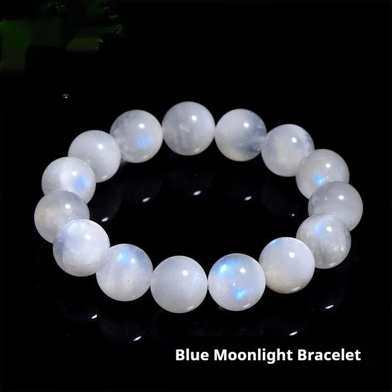 White polished moonstone bead bracelet with blue moonlight sheen, showing round geometric beads.
