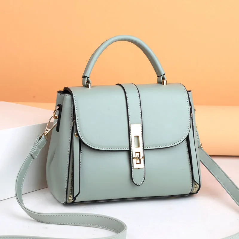 Women's soft PU leather messenger bag in square vertical design, shown in one of four colours: black, red, green, or blue.