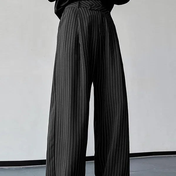 Men's black vertical striped pleated casual trousers showing elastic fabric and detailed sizing