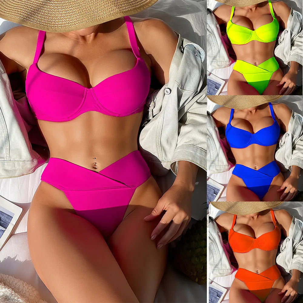 Solid colour bikini swimsuit in fluorescent pink on a mannequin, showing briefs style and sleeveless design.