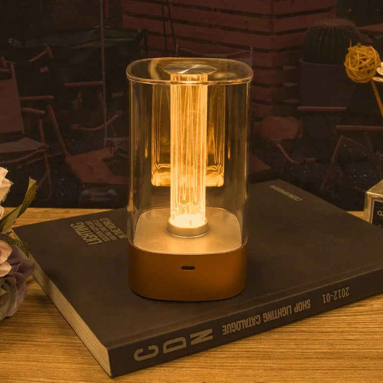 Rose gold LED touch atmosphere light with Auspicious Cloud pattern on a bedside table, USB charging cable included
