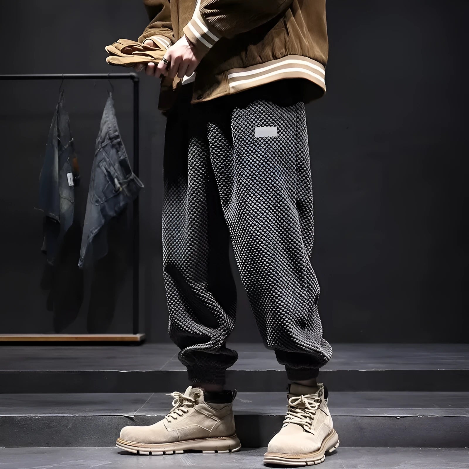 Grey men's casual sweatpants with ankle tie fastening and straight leg on a neutral background.