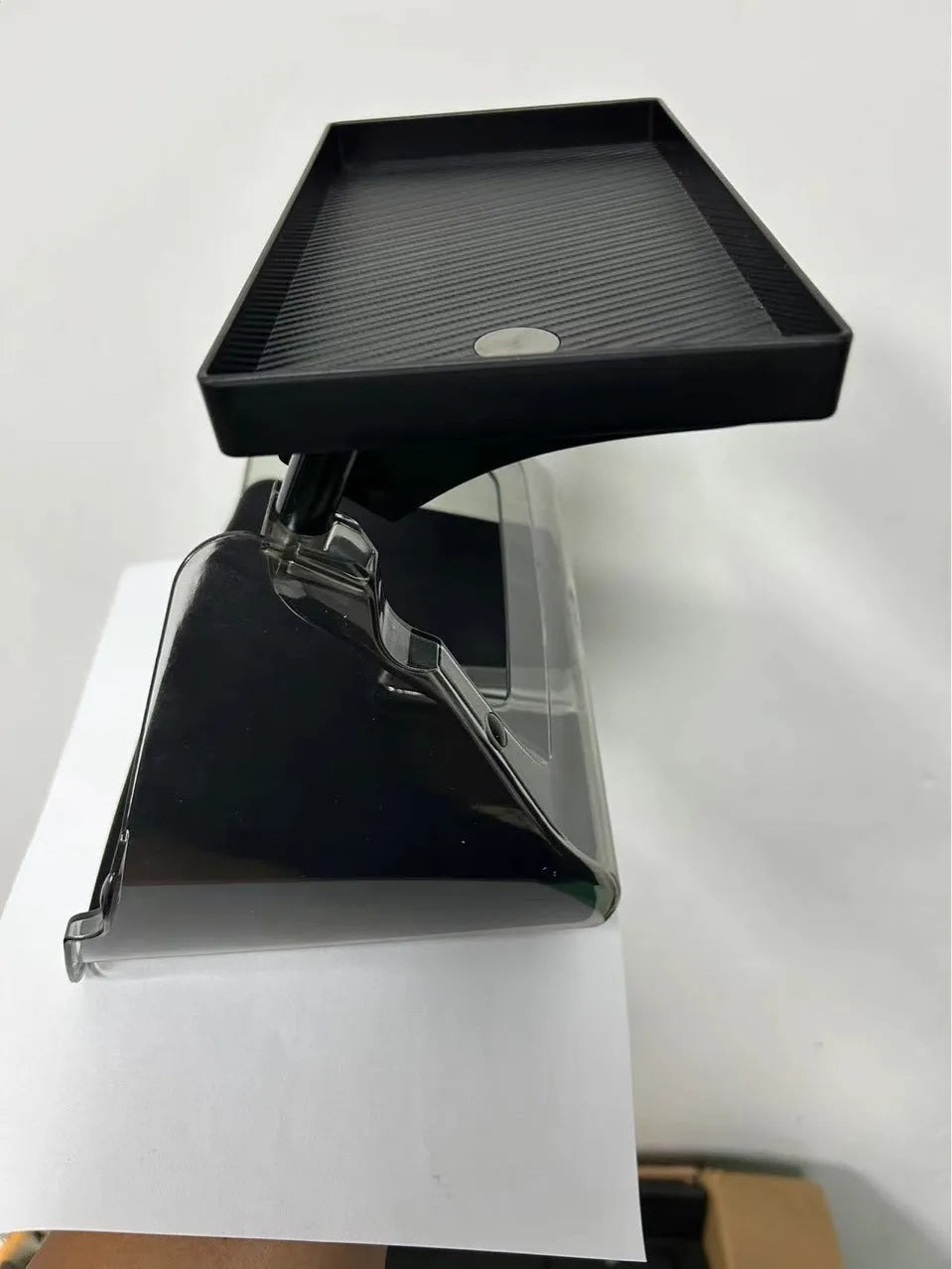 Black ABS storage box placed under Tesla Model 3 centre screen