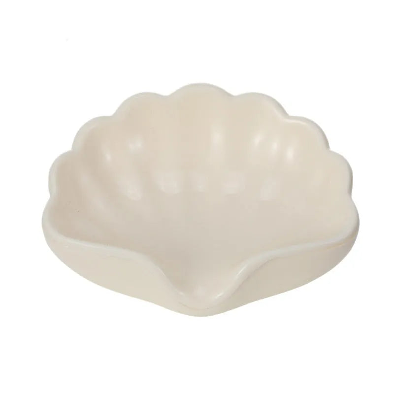 Plastic shell soap dish in Pearl White or Cherry Blossom Pink measuring 12x9x5.5cm for bathroom use