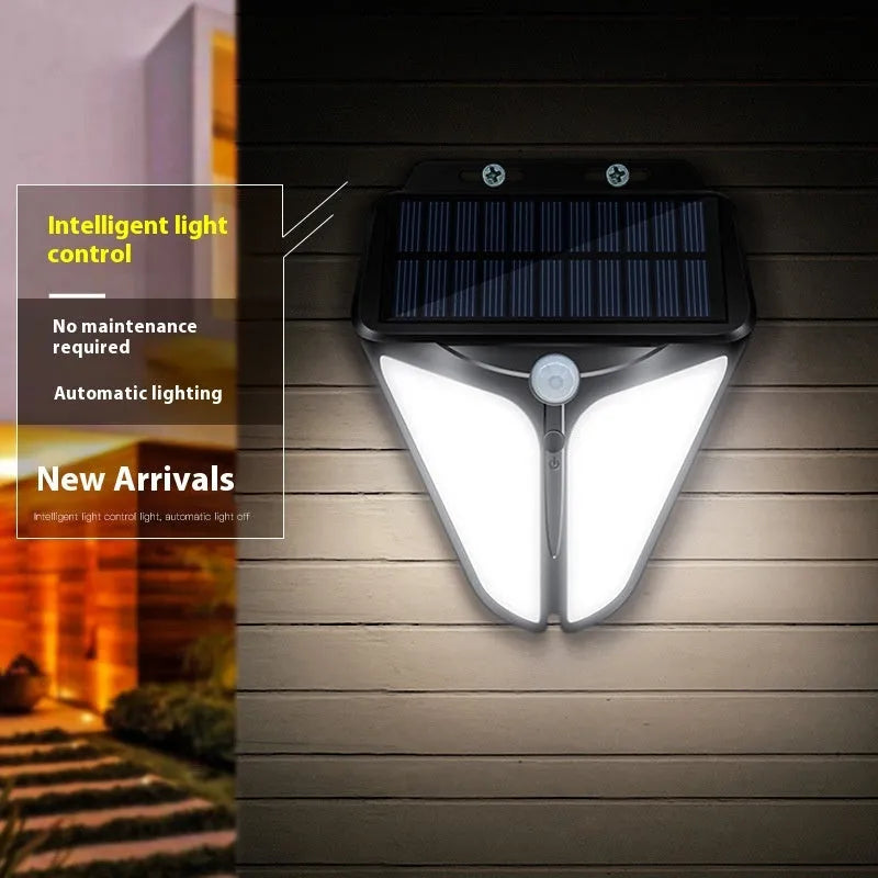Heart-shaped human induction solar wall lamp mounted on wall with warm light glow