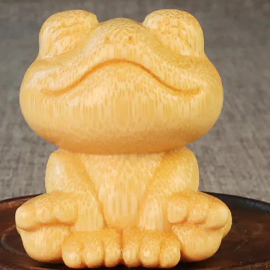 Solid bamboo smiling frog cartoon ornament measuring 5cm tall.