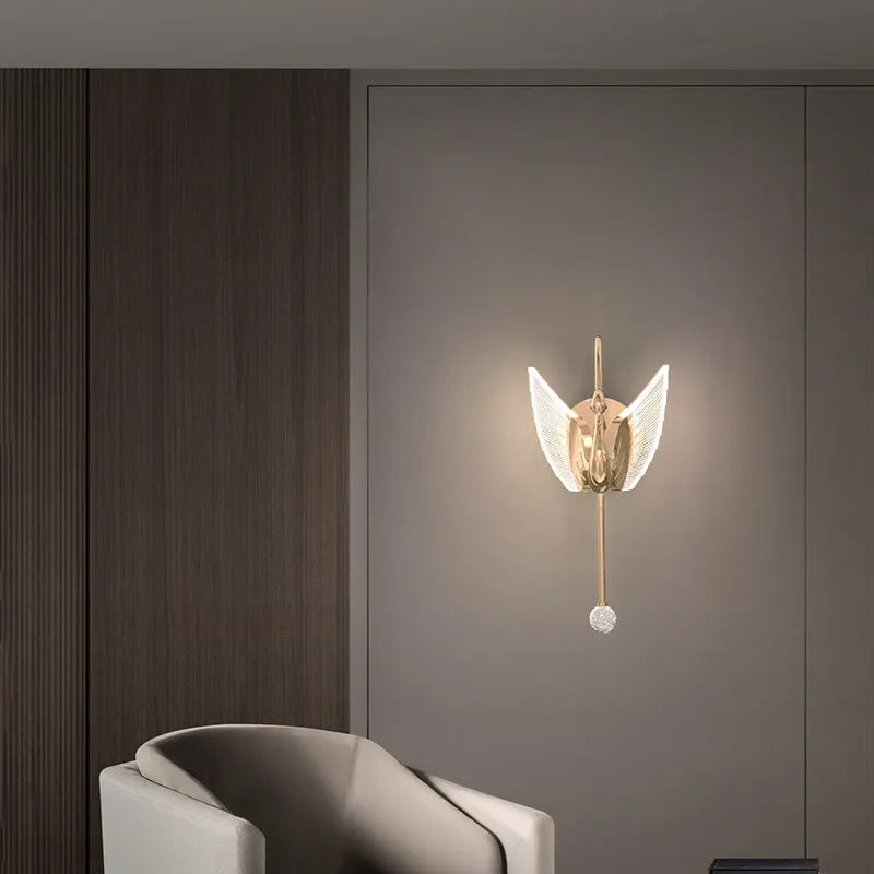 Gold swan-shaped wall lamp with iron construction and acrylic shade