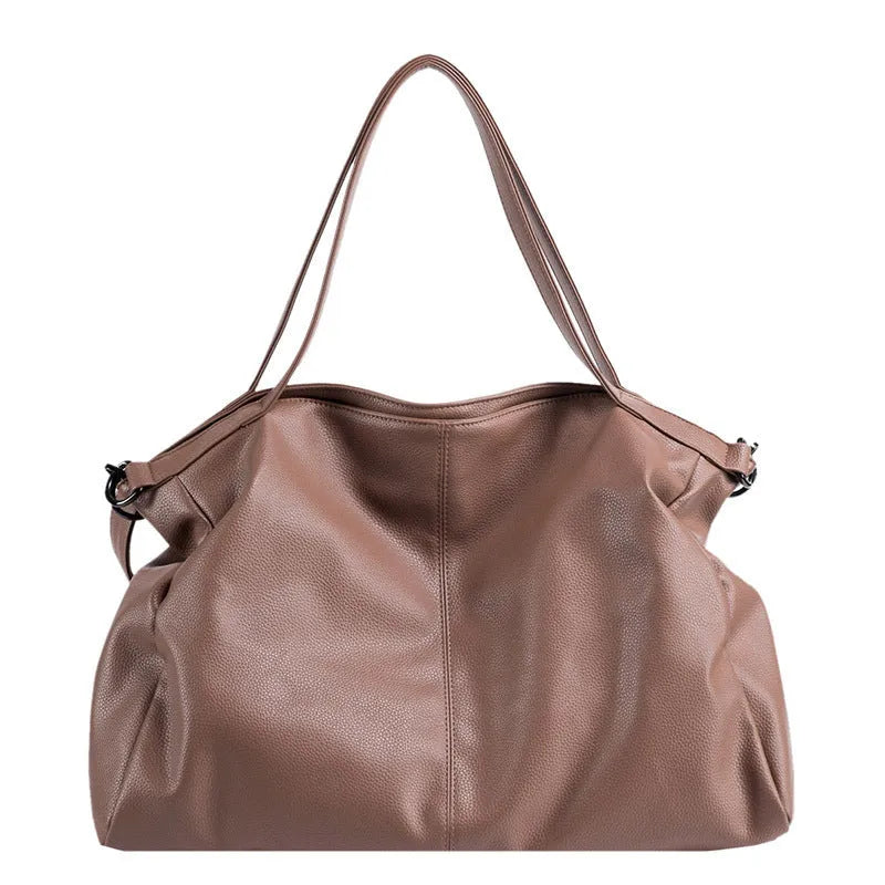 Large soft surface messenger bag with zip opening and adjustable shoulder strap in four colour options