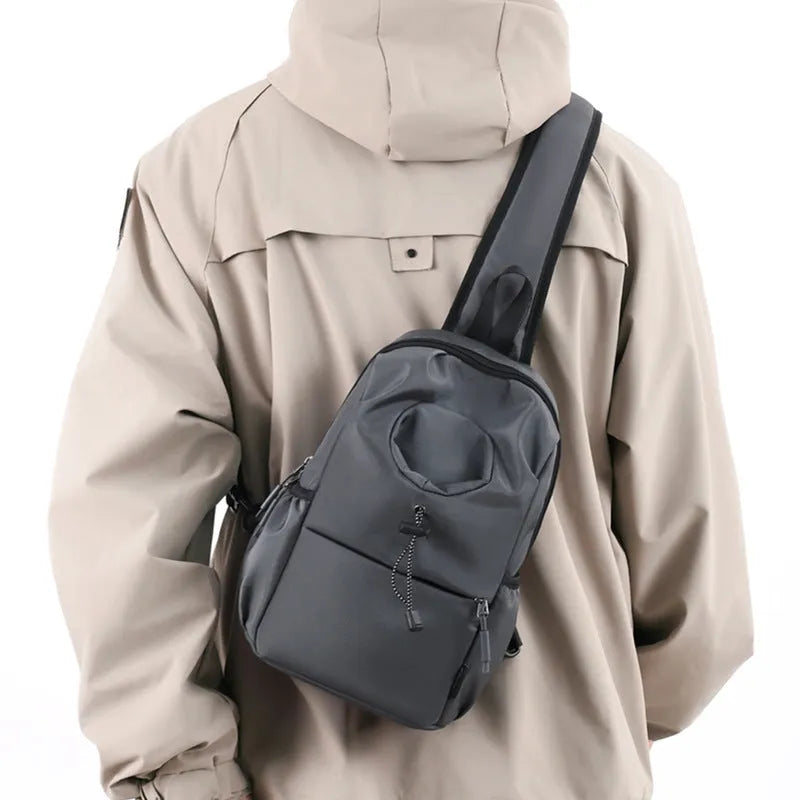 Oxford cloth waterproof shoulder chest bag for men in black with stitching detail