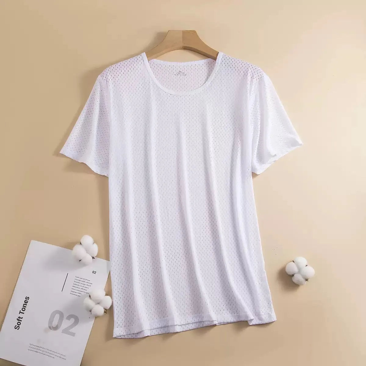 Man wearing a loose-fit black Ice Silk short sleeve t-shirt with crew neck for summer.