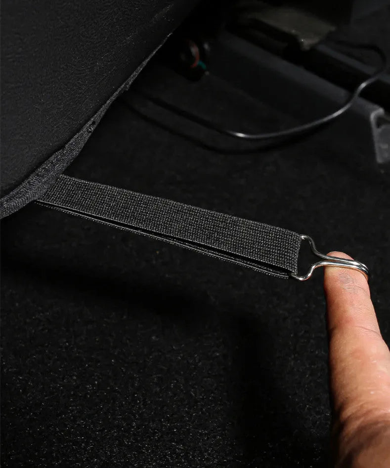 Set of two black leather rear seat anti kick pads with a storage pocket.