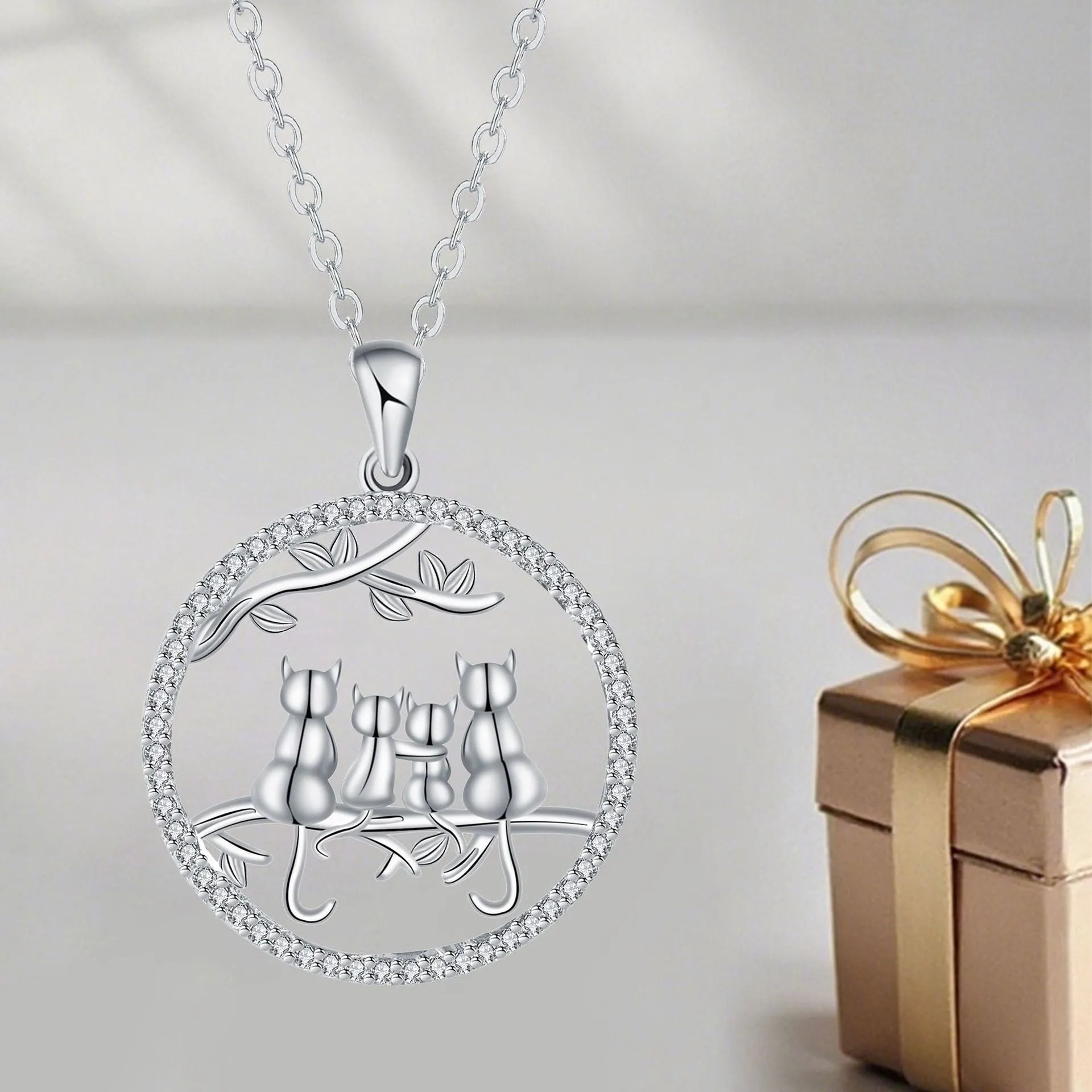 Women's four kitten necklace with copper pendant and cross chain in electroplated finish