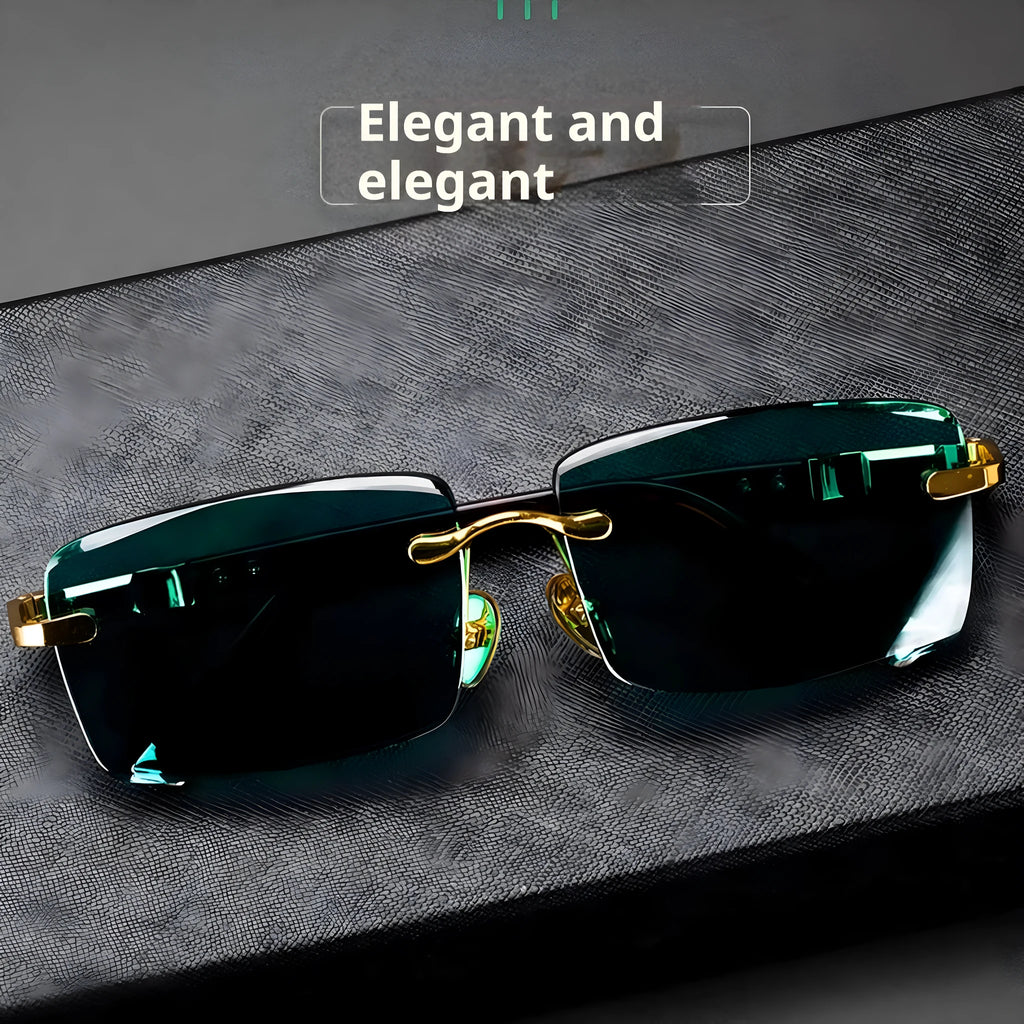 Dark green frameless crystal sunglasses with a distinctive design, shown with a hard case and lens cloth.