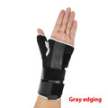 Black sports wrist guard with carbon fibre panel and adjustable thumb strap for weightlifting support