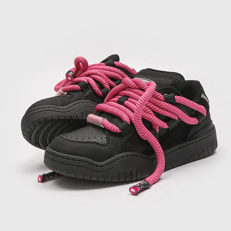 A pair of solid-colour casual lace-up shoes with a thick rubber sole and round toe