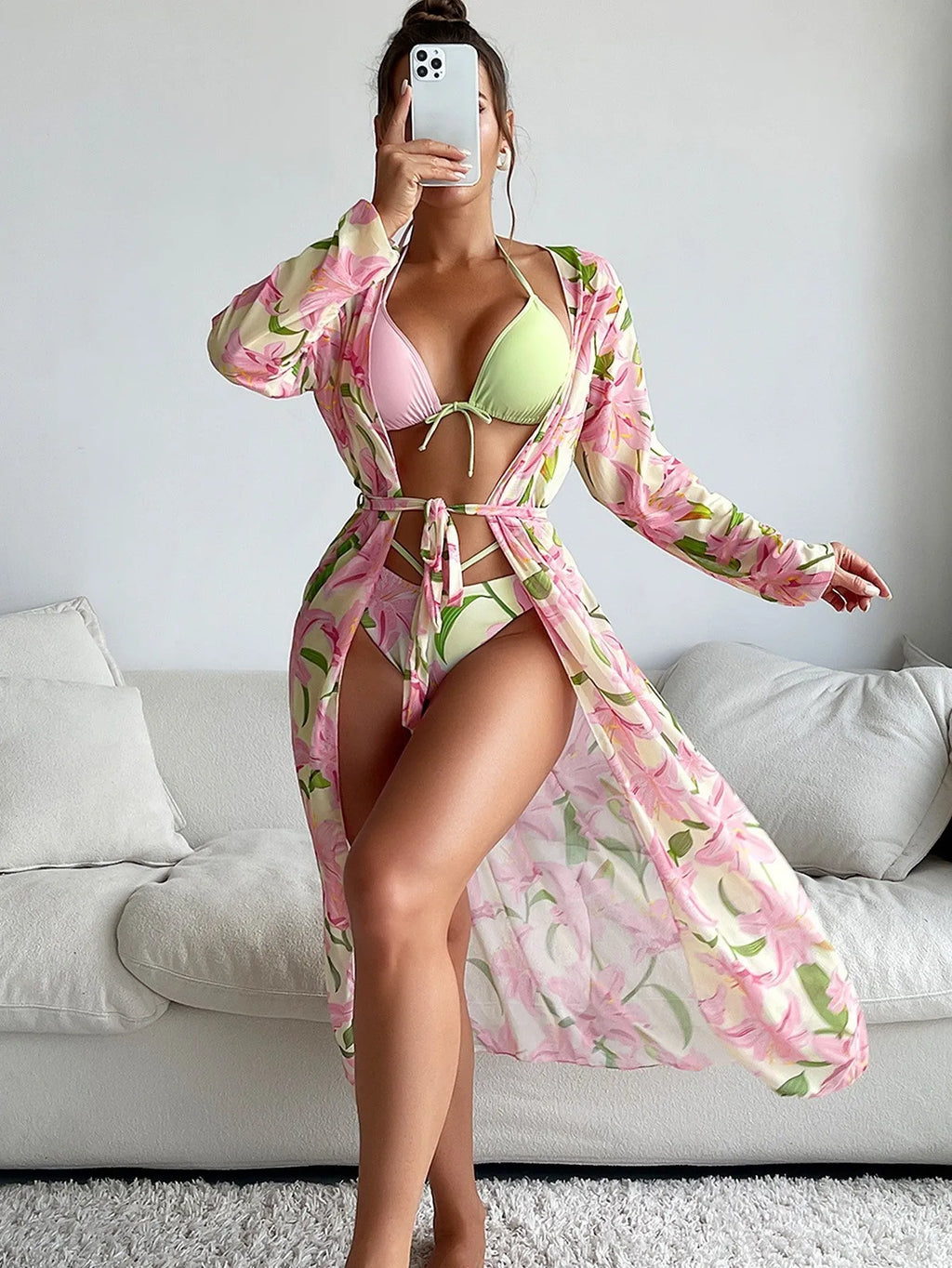 Colourful printed women's bikini swimsuit on a white background.