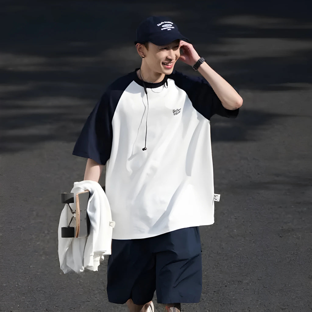 Blue loose-fit men's casual raglan sleeve T-shirt on a hanger.