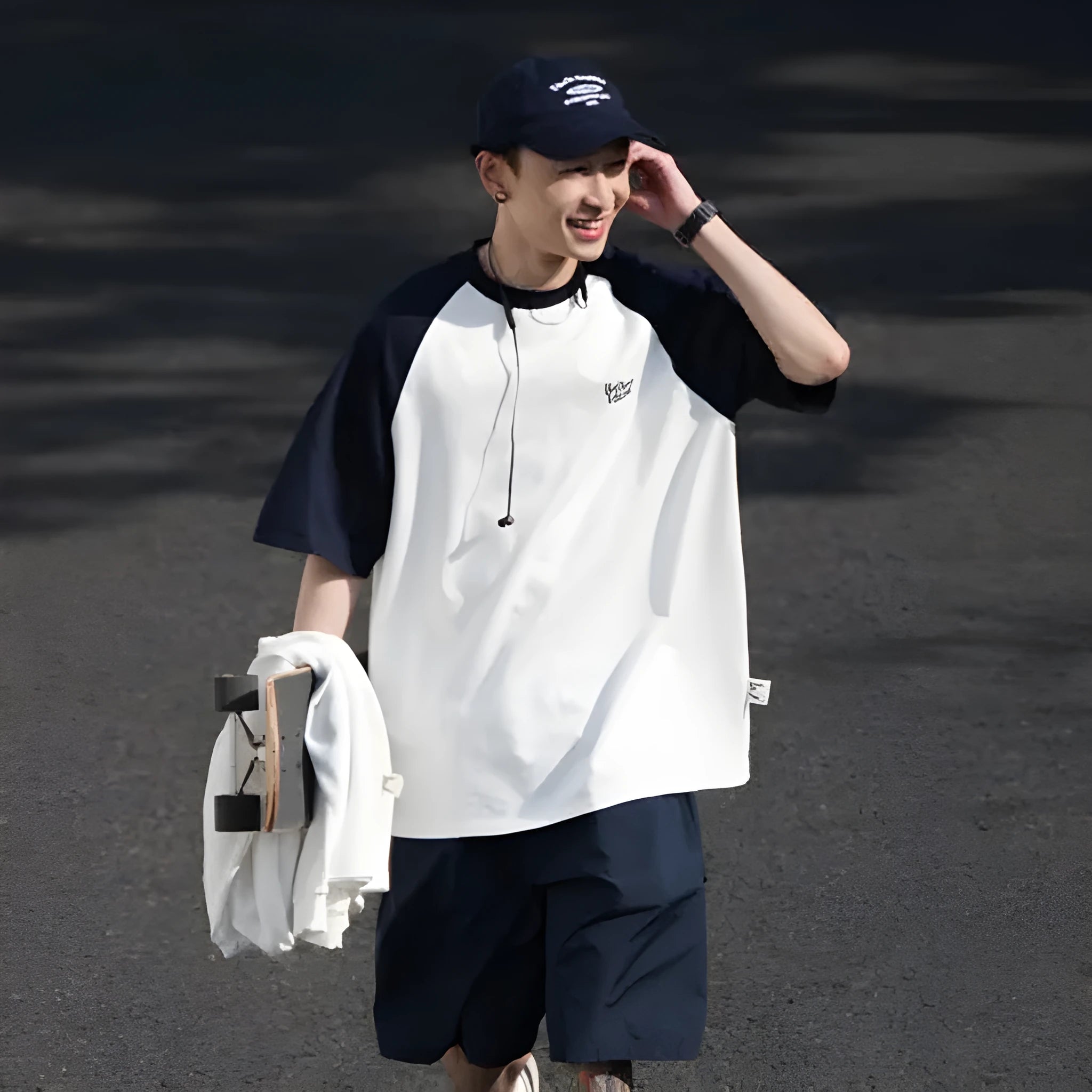 Blue loose-fit men's casual raglan sleeve T-shirt on a hanger.