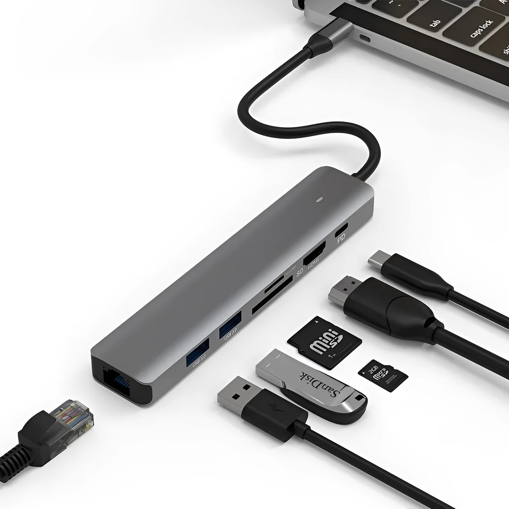Silver aluminium USB C 7-in-1 hub with HDMI, USB 3.0 ports, and SD card slots.