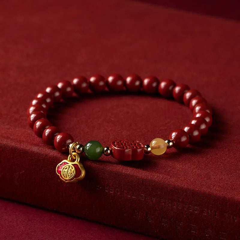 Happy Eyebrow Bracelet with fu character charm in cinnabar emperor sandstone beads.