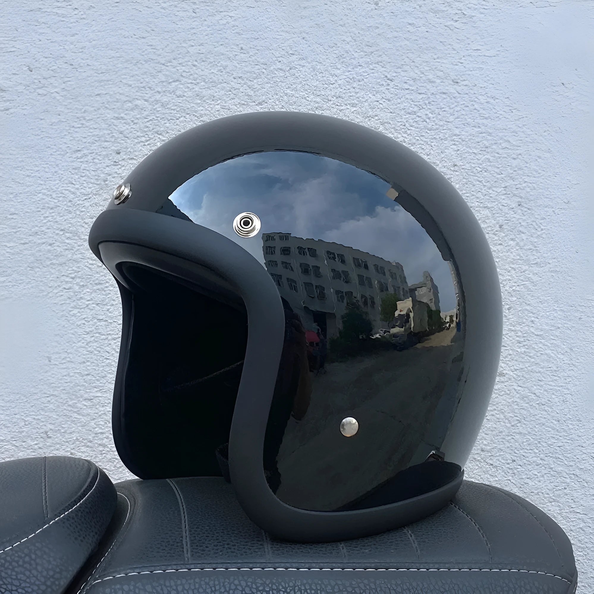 Retro-style open-face motorcycle helmet in glass fibre construction shown in a cement grey colour.