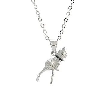 Close-up of a sterling silver cat pendant necklace on a dark background, showing the detailed charm.