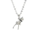 Close-up of a sterling silver cat pendant necklace on a dark background, showing the detailed charm.
