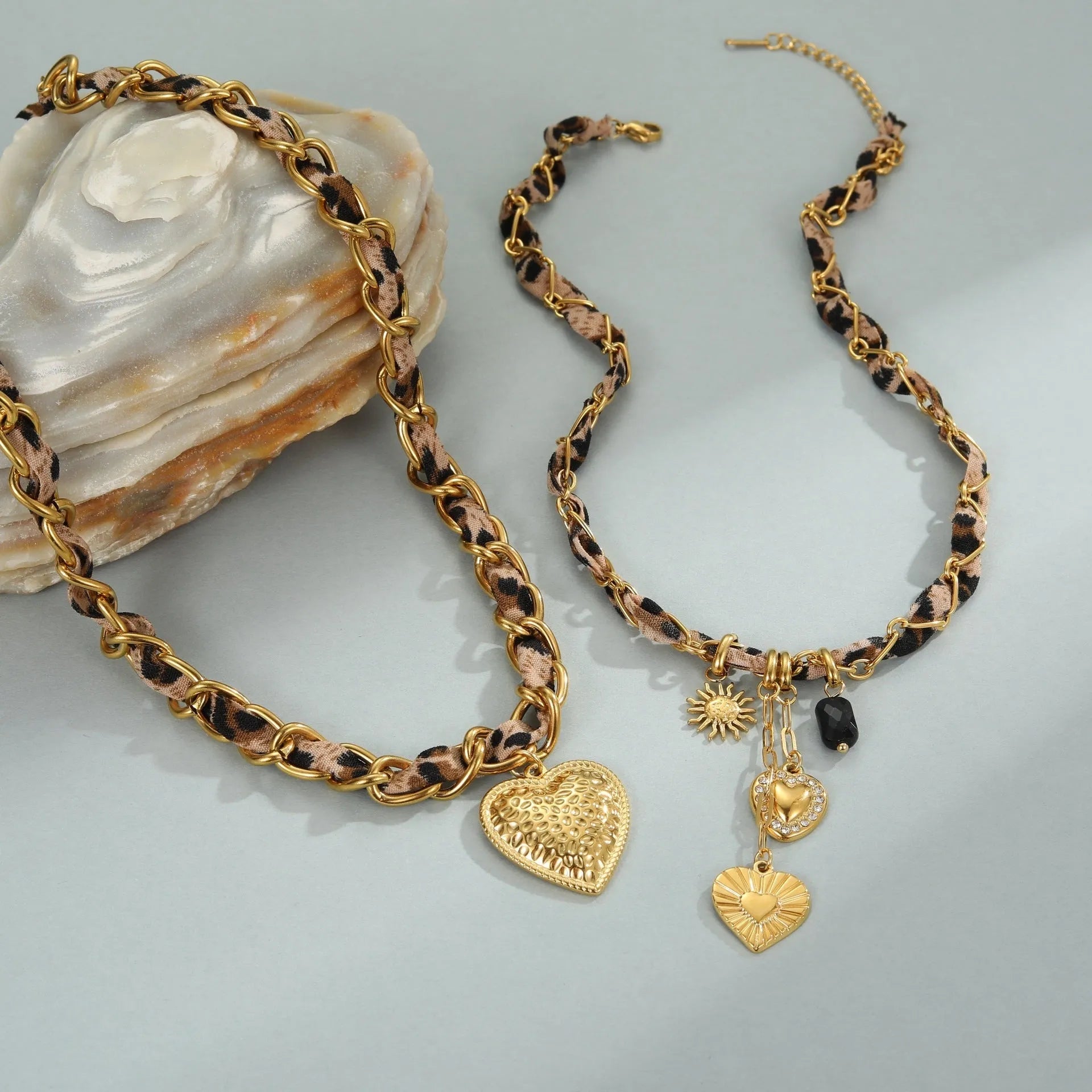 Stainless steel women's necklace with 18K gold electroplating showing geometric pendant design