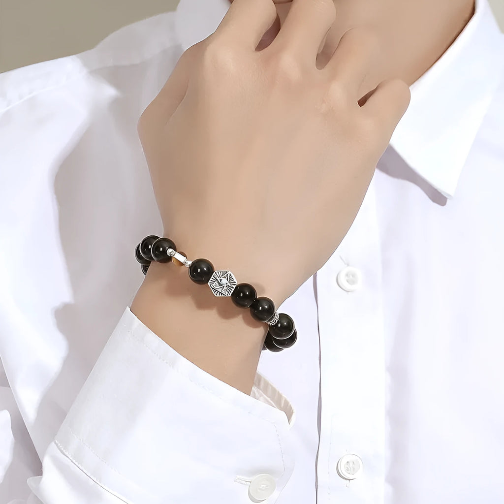 Men's S925 sterling silver God's Eye obsidian bracelet with 8mm geometric beads on a neutral background