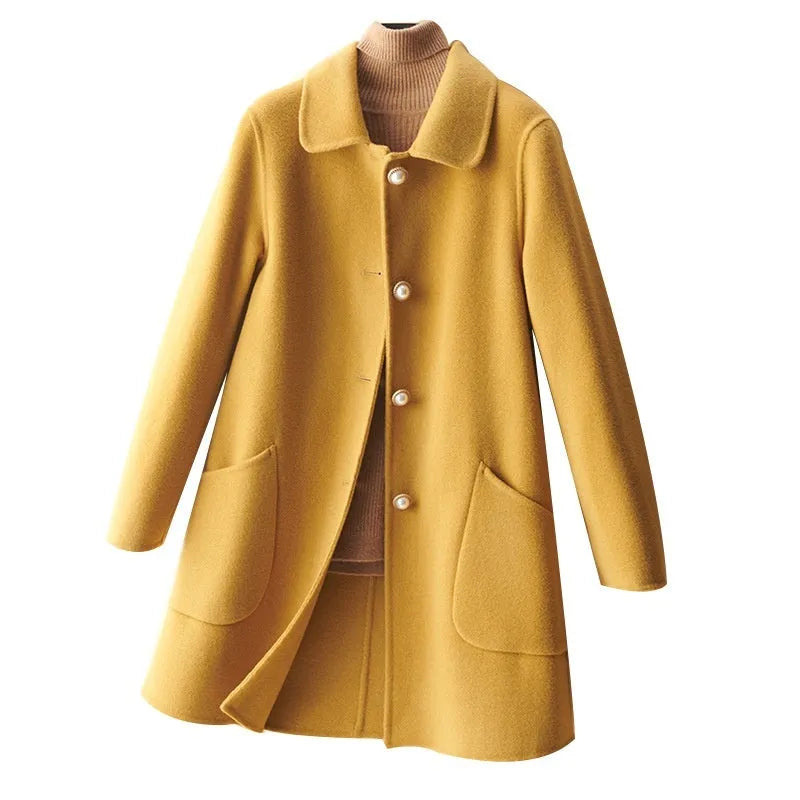 Women's wool double-faced mid-length coat with pearl buckle, doll collar, and front pockets in solid colour