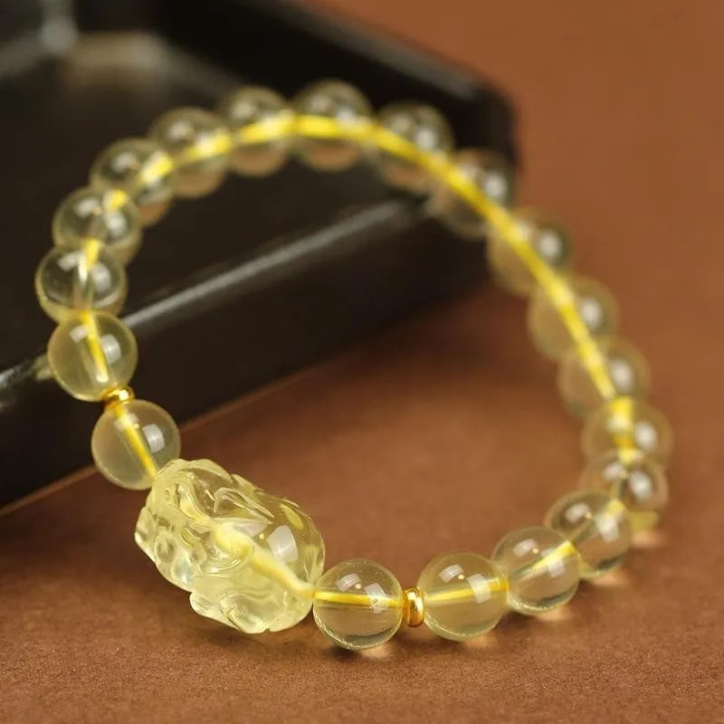 Yellow Citrine Pi Xiu bracelet with artificial crystal beads and leather clasp in national style.