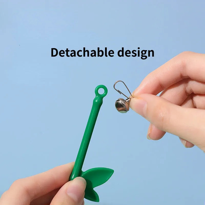 Interactive cat toy feather wand with green bells and feathers on a durable wand