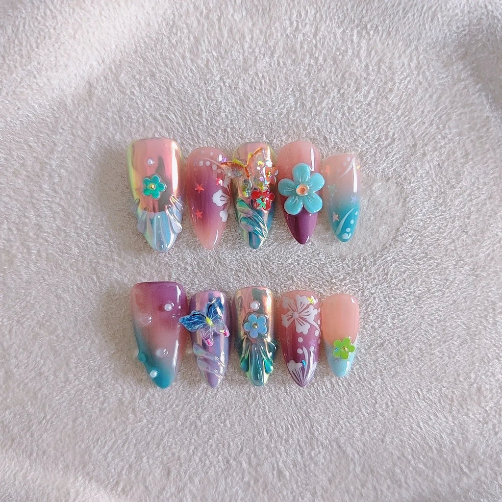 Handmade colourful nail sculptures with floral patterns and embossed butterfly designs