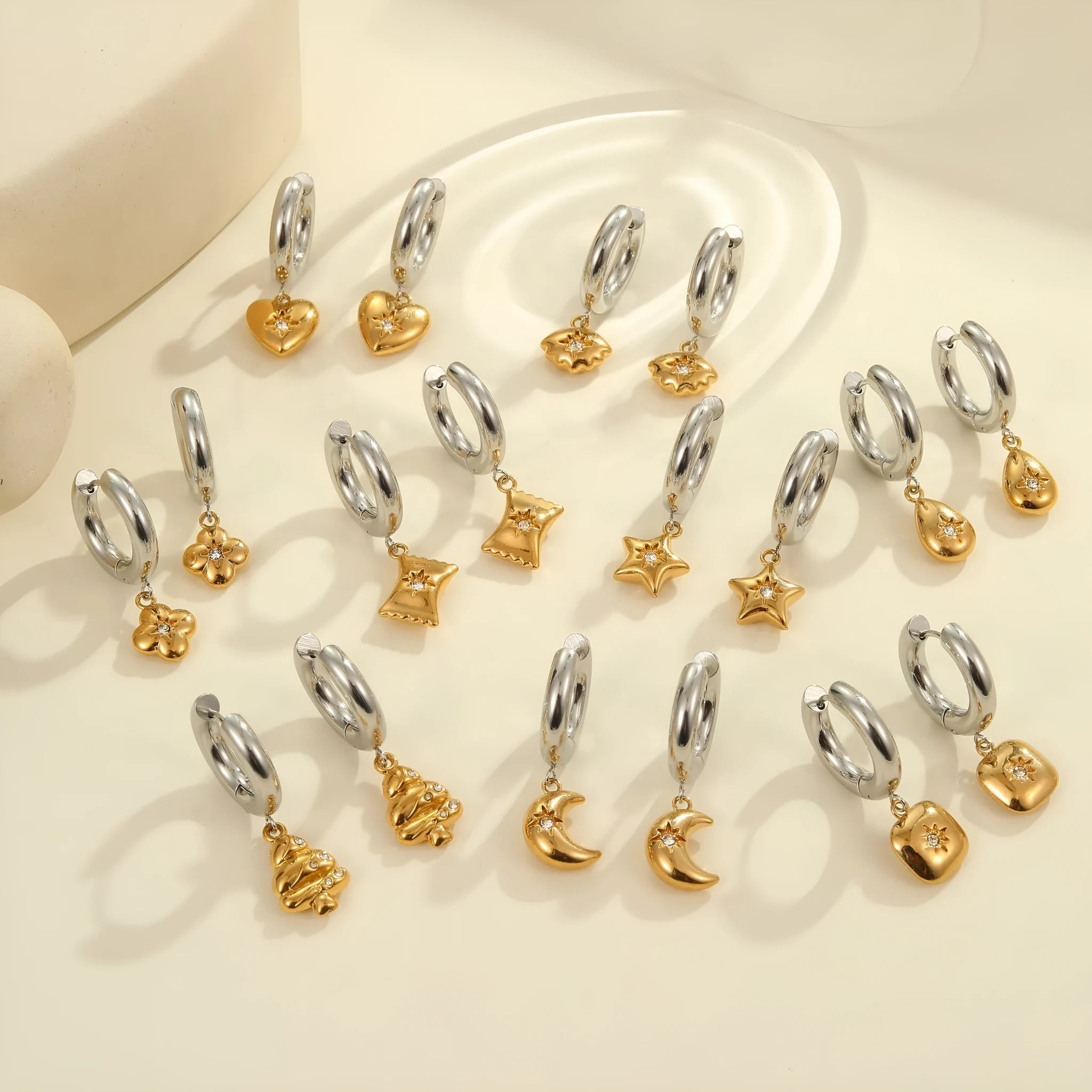 A pair of gold-coloured Christmas tree heart earrings for women, made from stainless steel with a star detail.